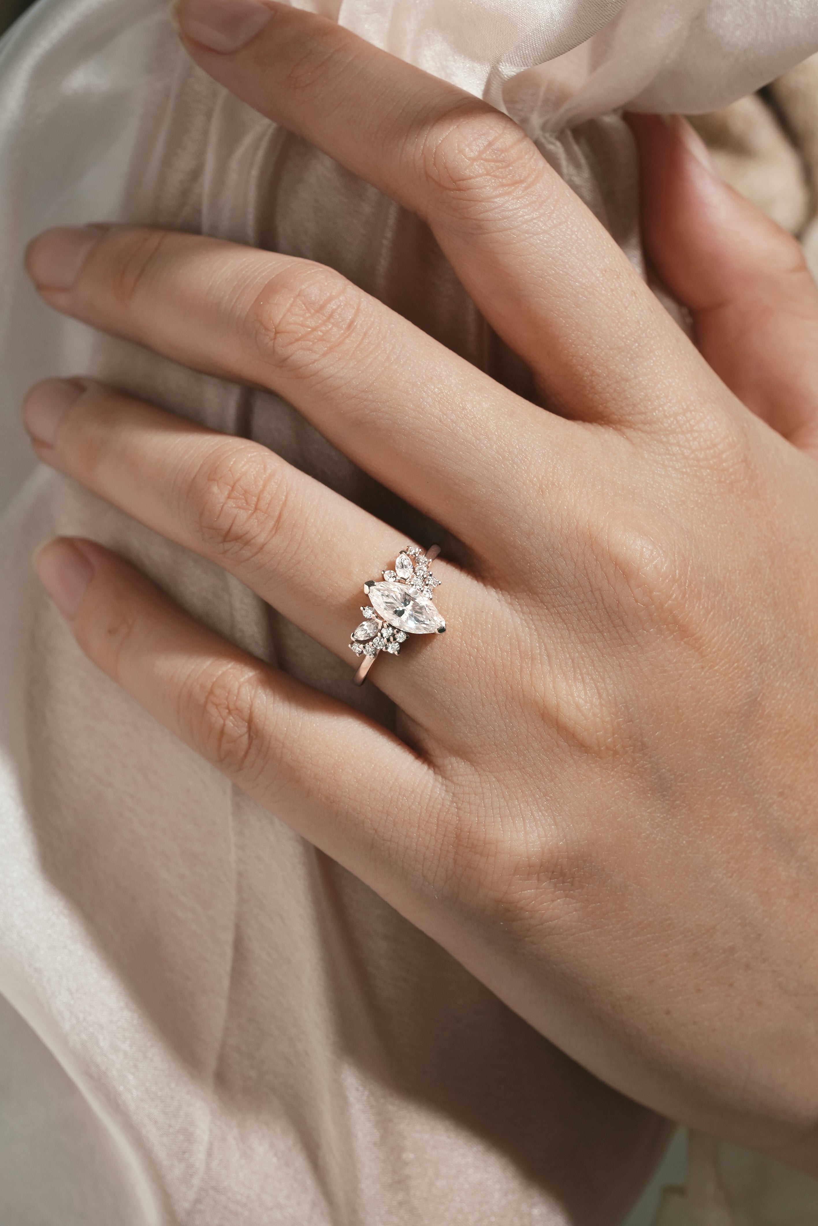 Marquise Cut Moissanite Engagement Ring on hand