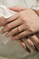 Elegant leaf pattern wedding band on hand, nature-inspired design