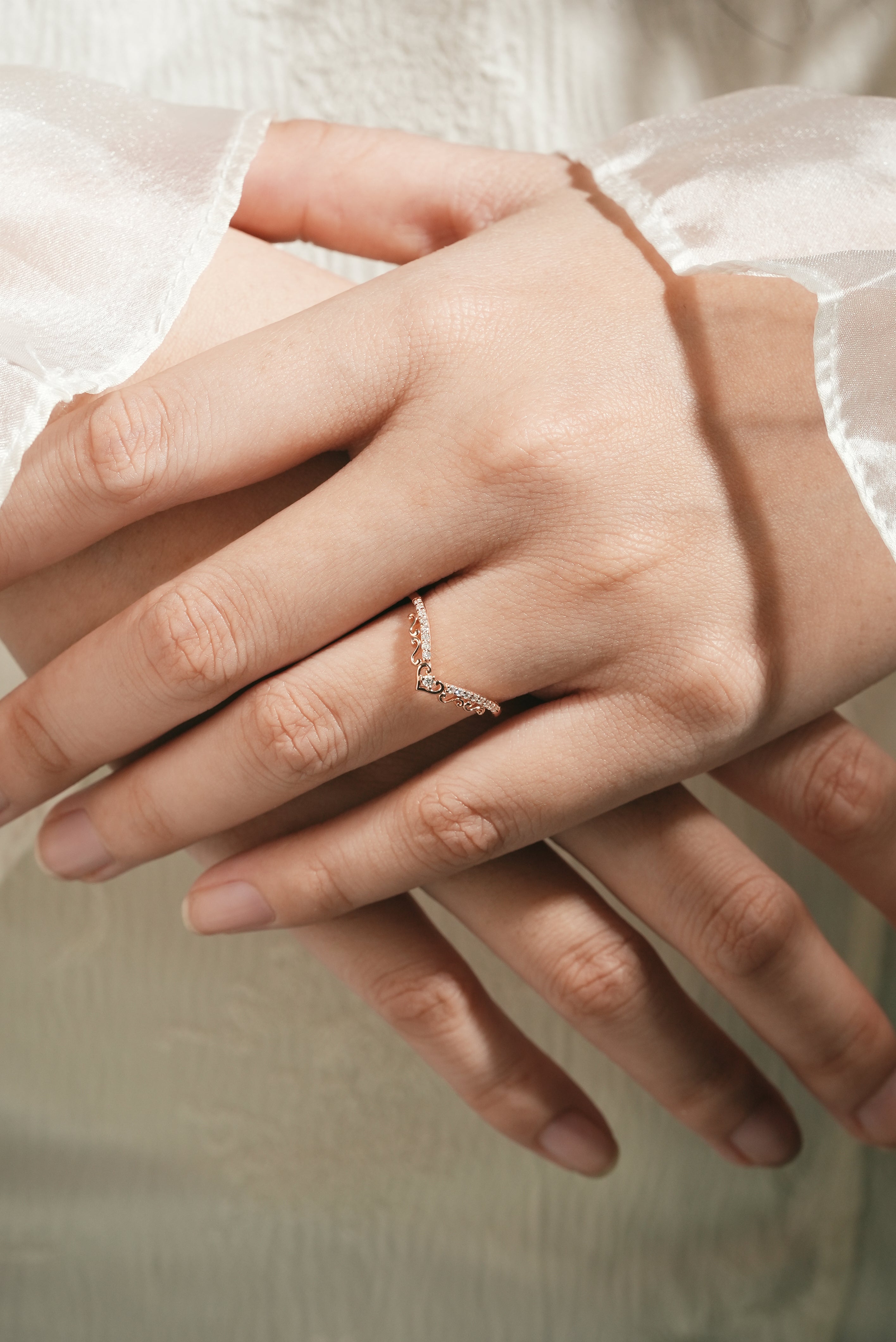 Rose gold chevron wedding band on hand