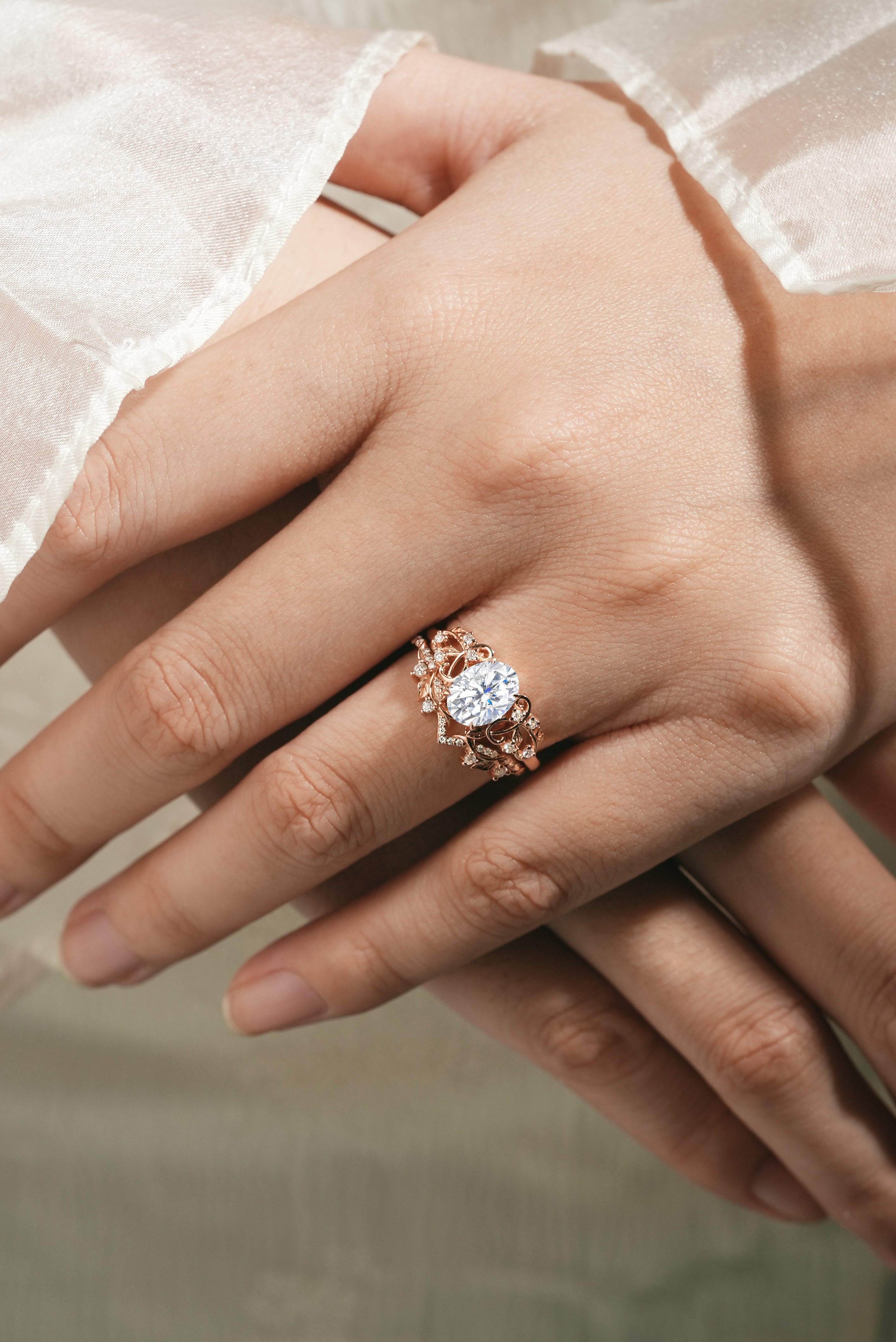 Oval moissanite leaf engagement ring set on hand, Rose gold
