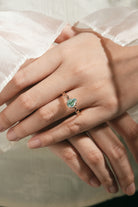 Moss Agate Pear Cut Engagement Ring on hand, nature-inspired design