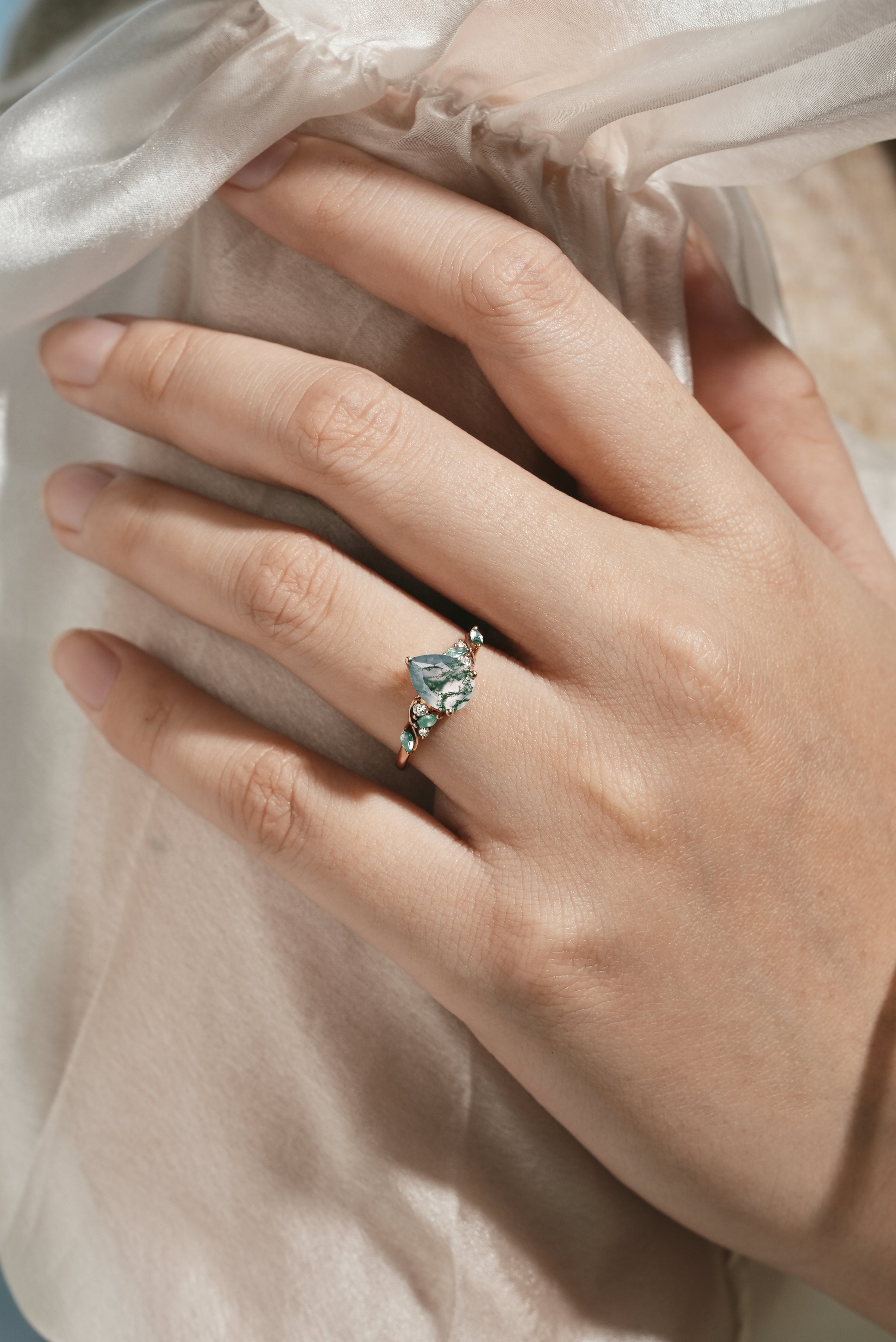 Nature-inspired pear cut moss agate engagement ring with moissanite accents