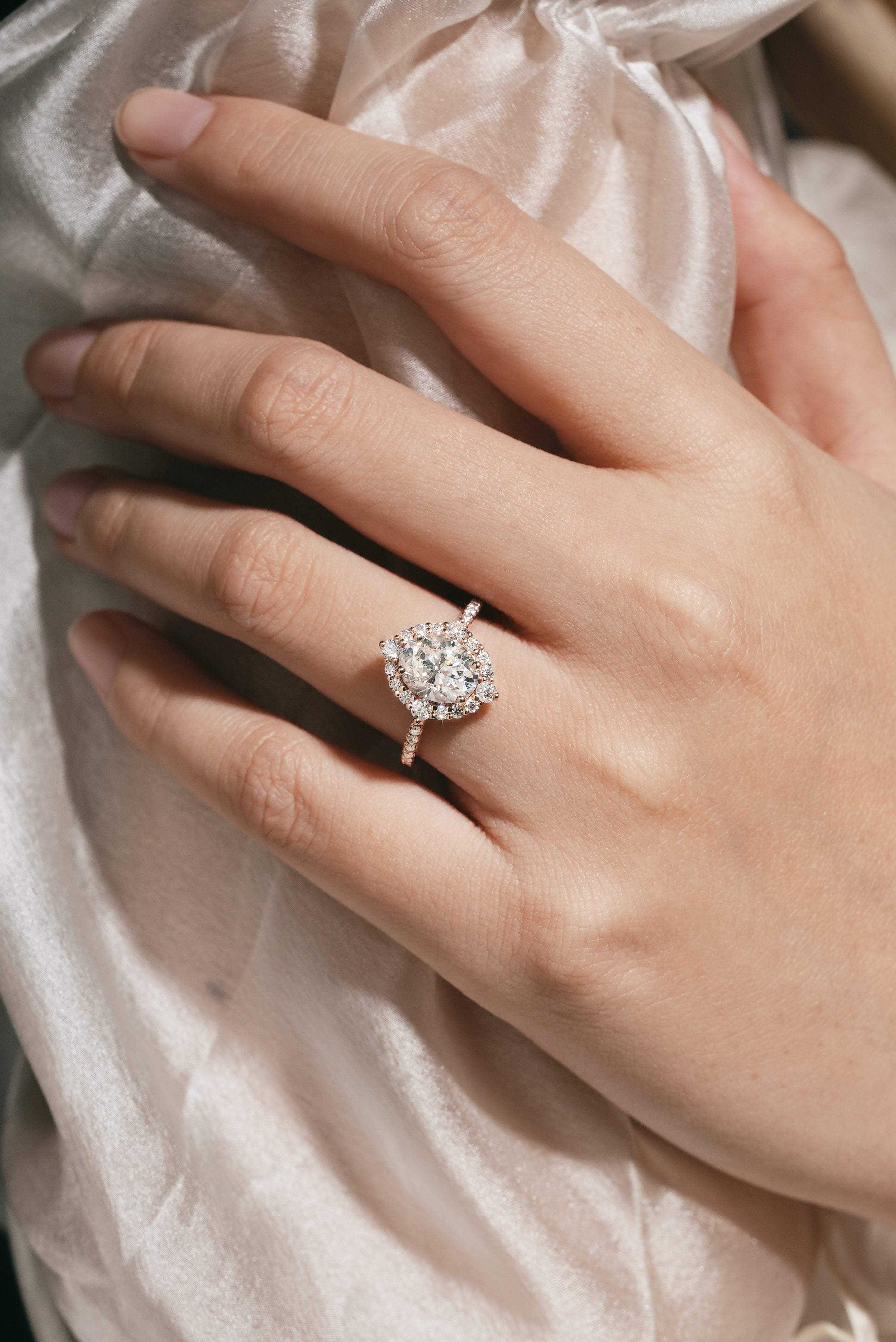 Oval Moissanite Halo Engagement Ring on a hand
