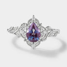 Nature-inspired alexandrite engagement ring with leaf details
