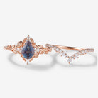 Rose gold pear-cut Alexandrite leaf bridal set with moissanite accents, vintage engagement ring set
