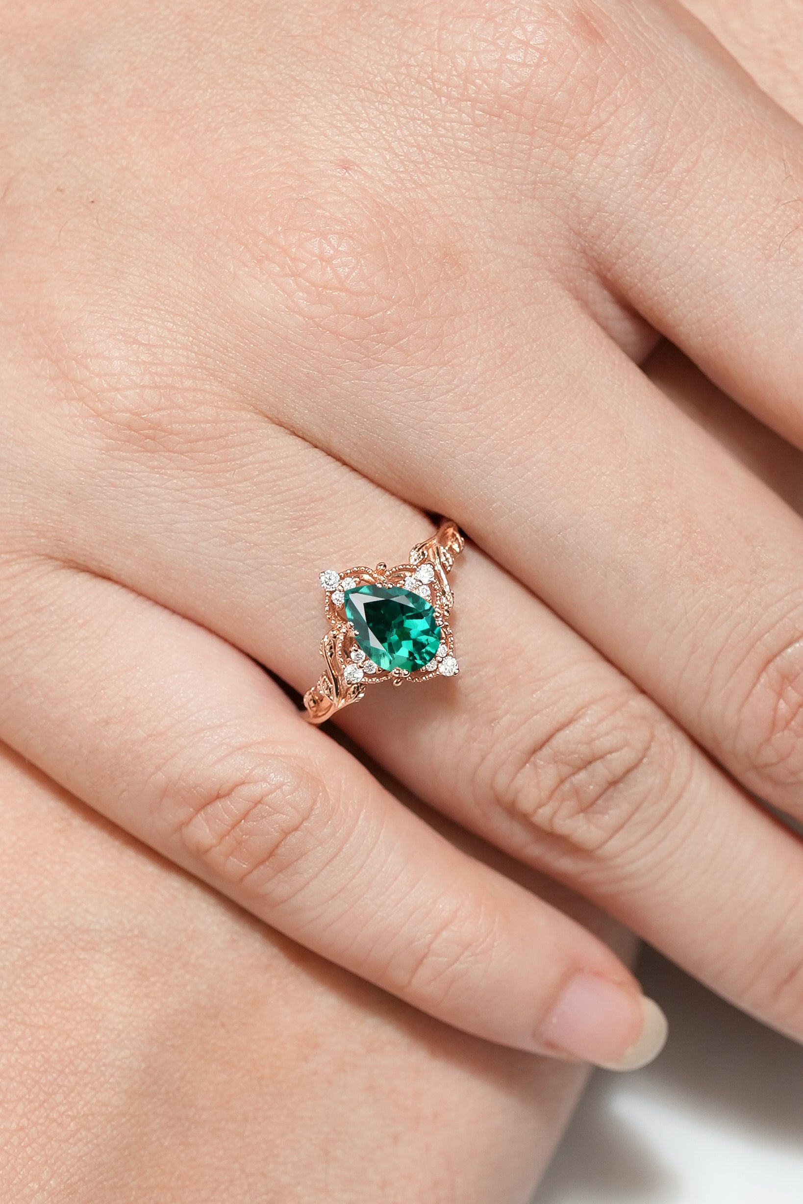 Square Emerald Engagement Ring with Leaf Detailing