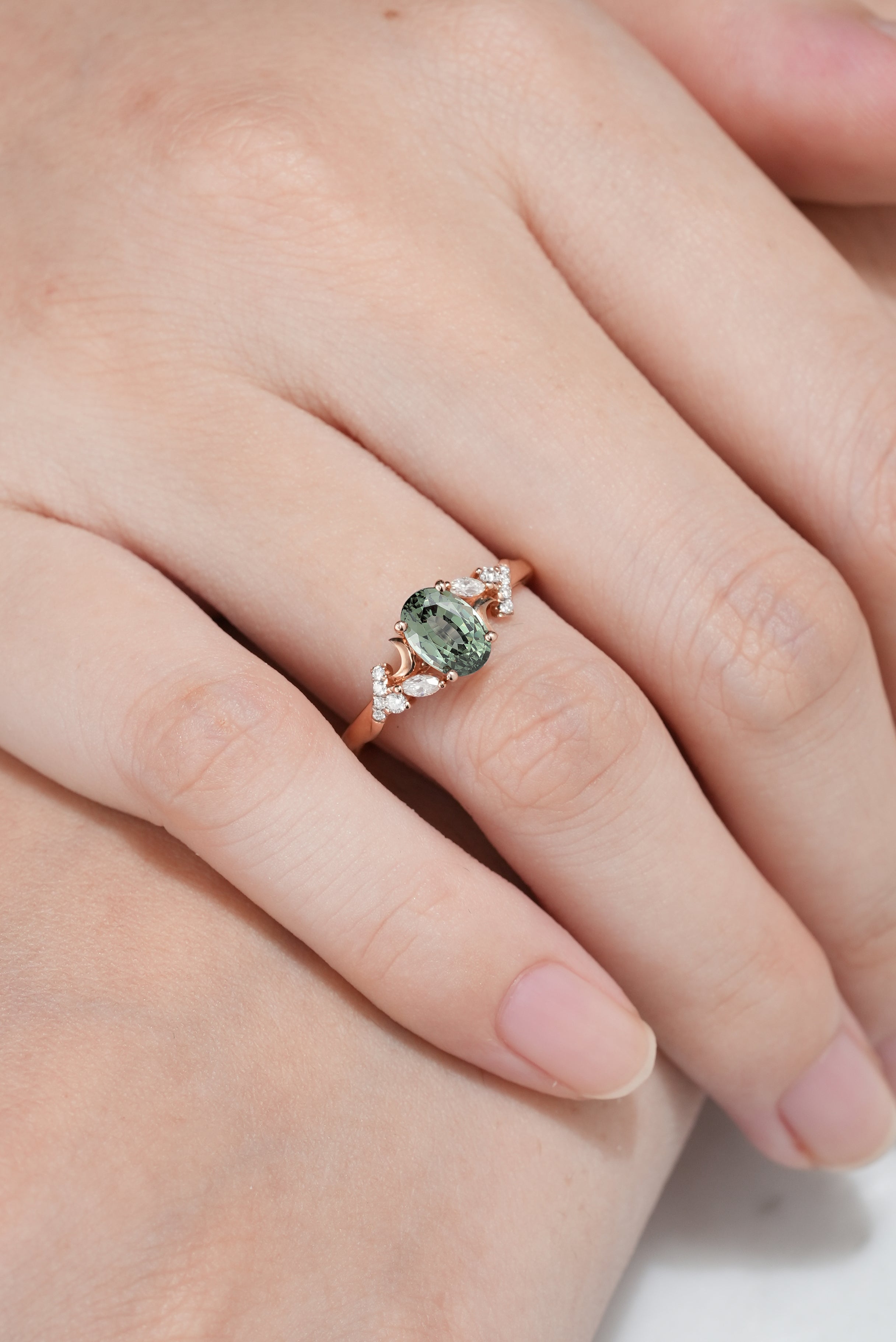 Unique Design Moon Oval Cut Green Sapphire Engagement Ring In A Woman's Hand