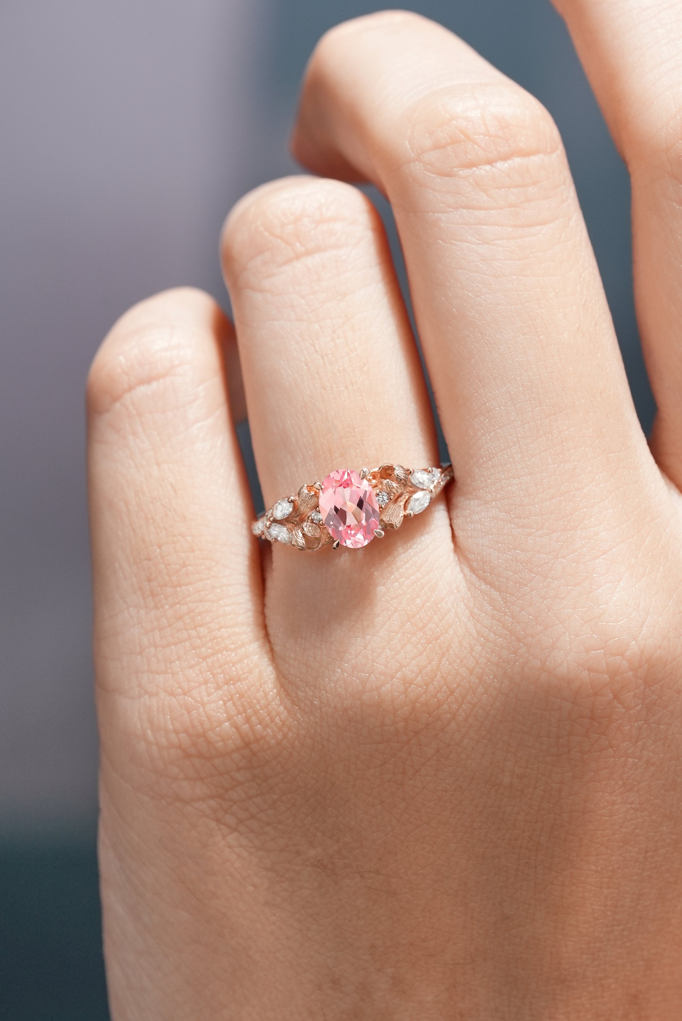 Nature Inspired Oval Cut Ring Pink Sapphire Floral Engagement Rings Worn on a hand