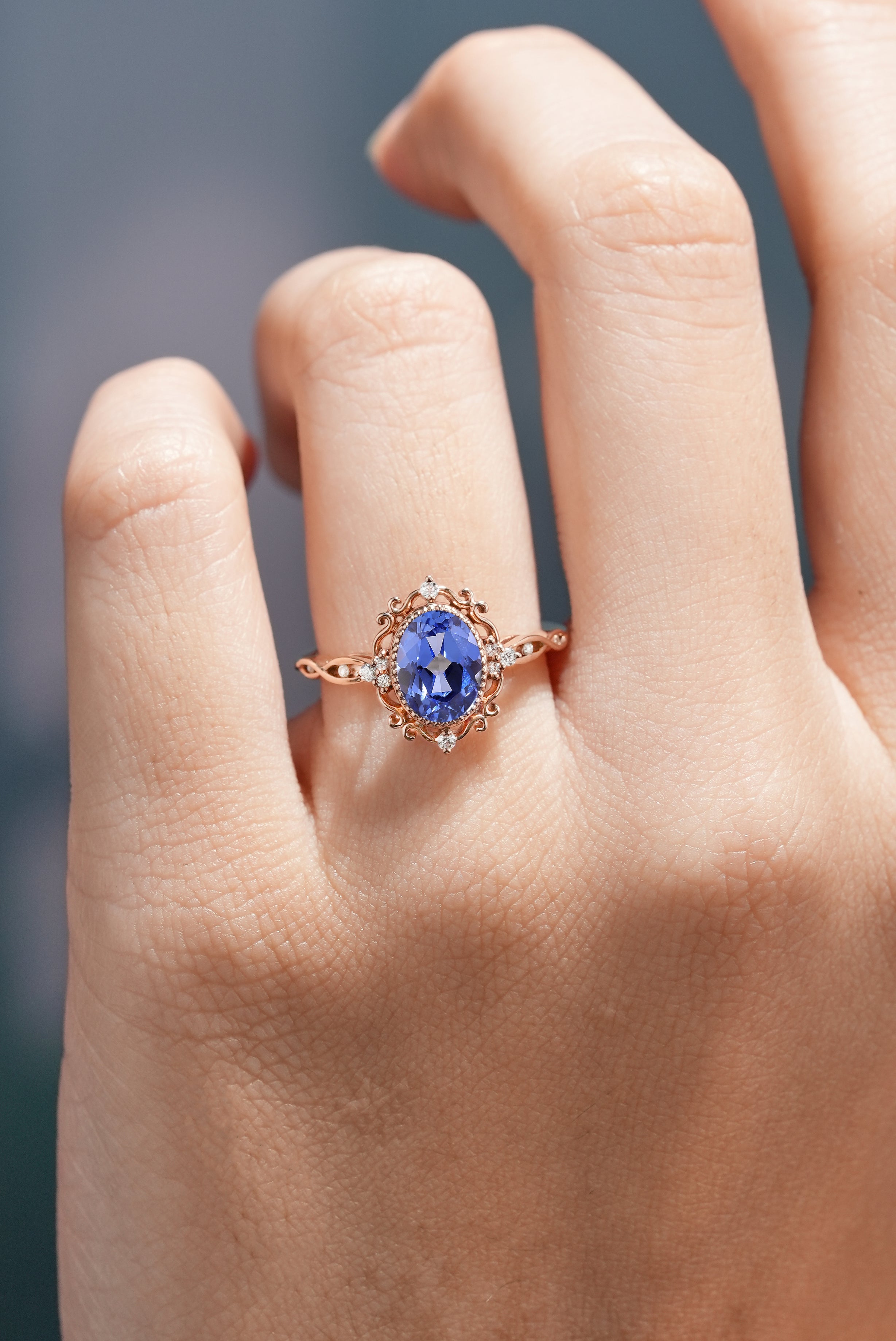 Vintage Oval Cut Lab Blue Sapphire Engagement Ring In A Finger