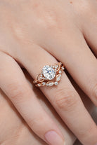 Rose gold moissanite engagement ring with nature-inspired leaf detailing