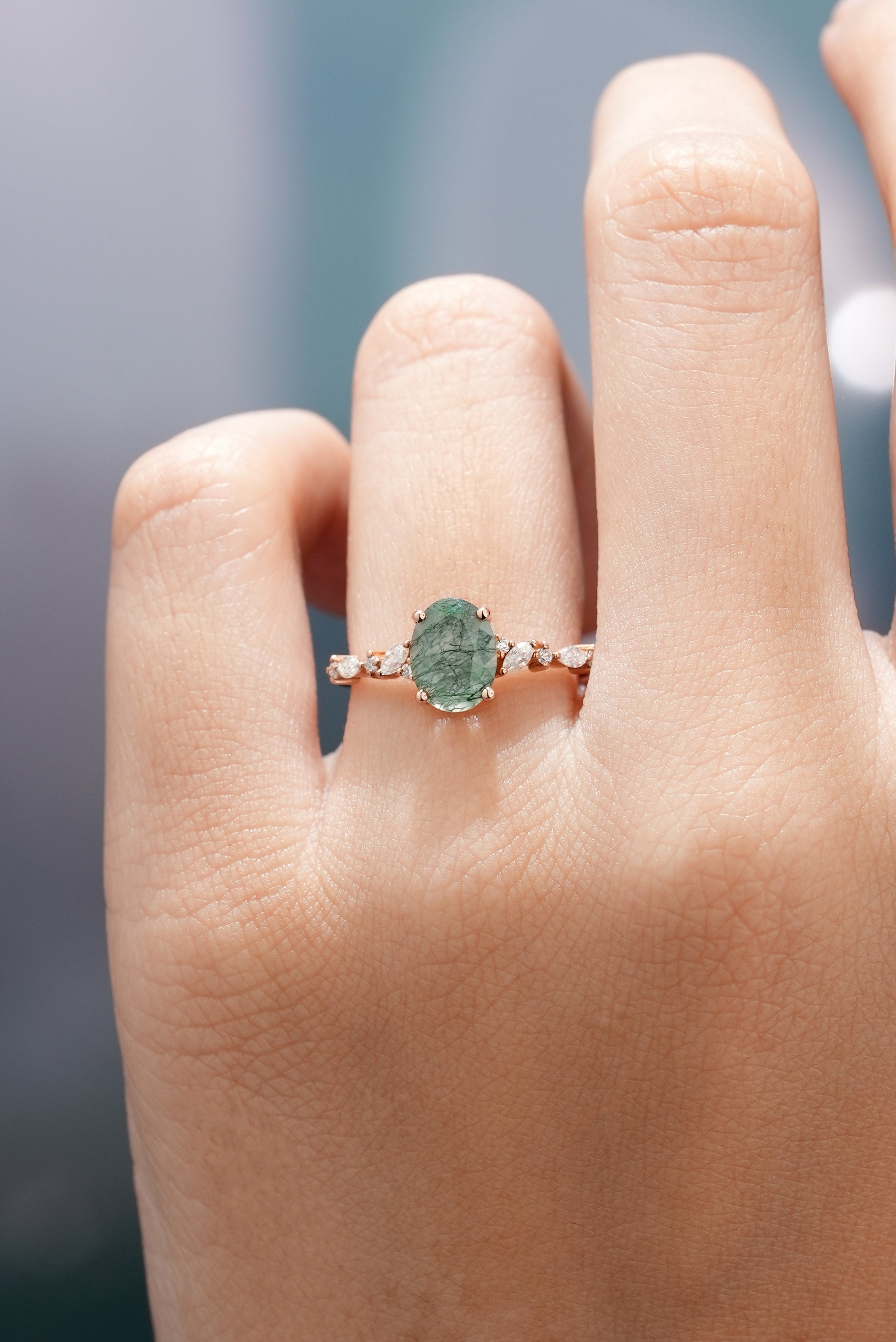 Oval moss agate engagement ring with moissanite accents