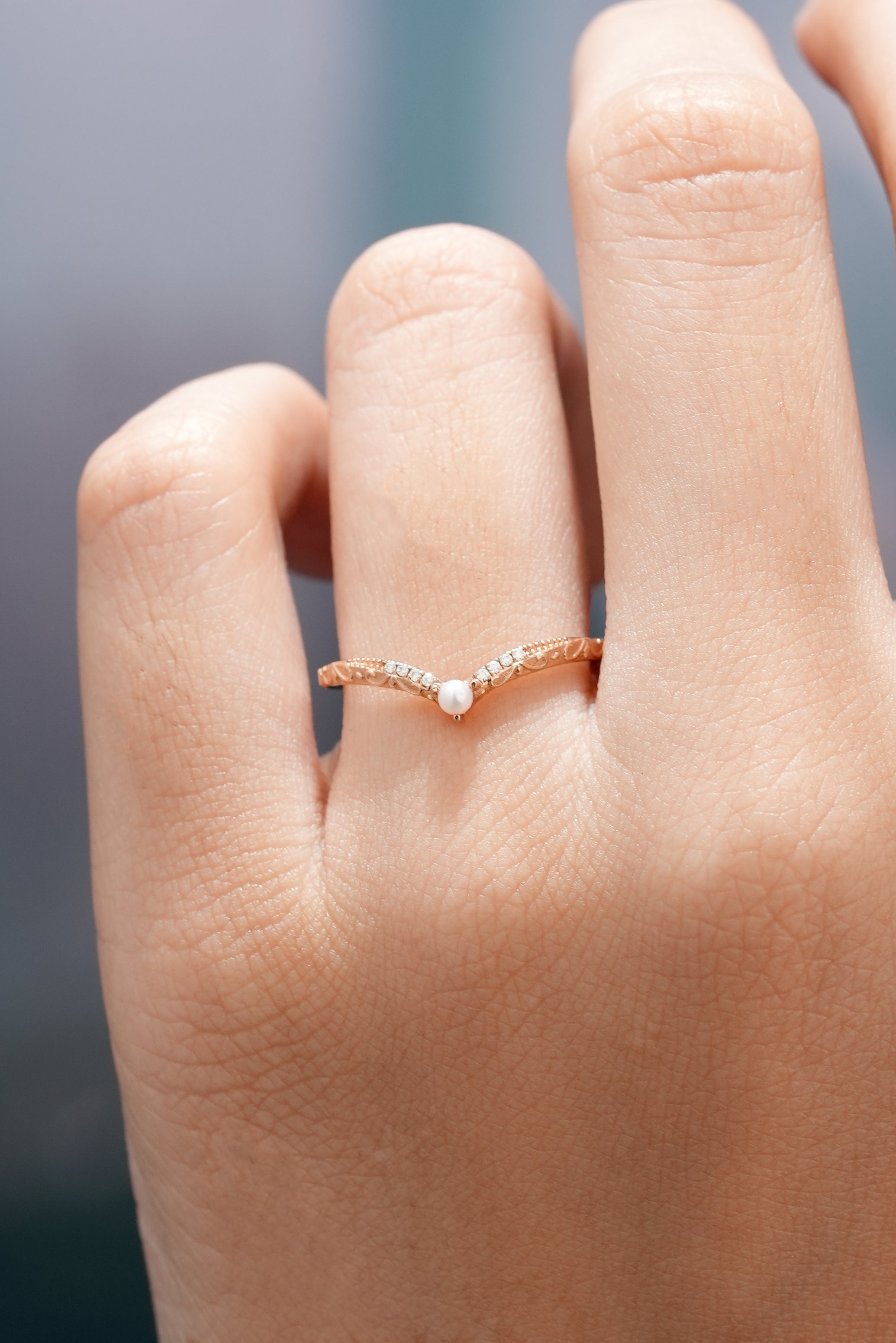 Vintage Rose Gold Moissanite Pearl Chevron Wedding Band On The Finger