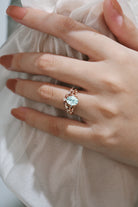Aquamarine leaf engagement ring on a hand