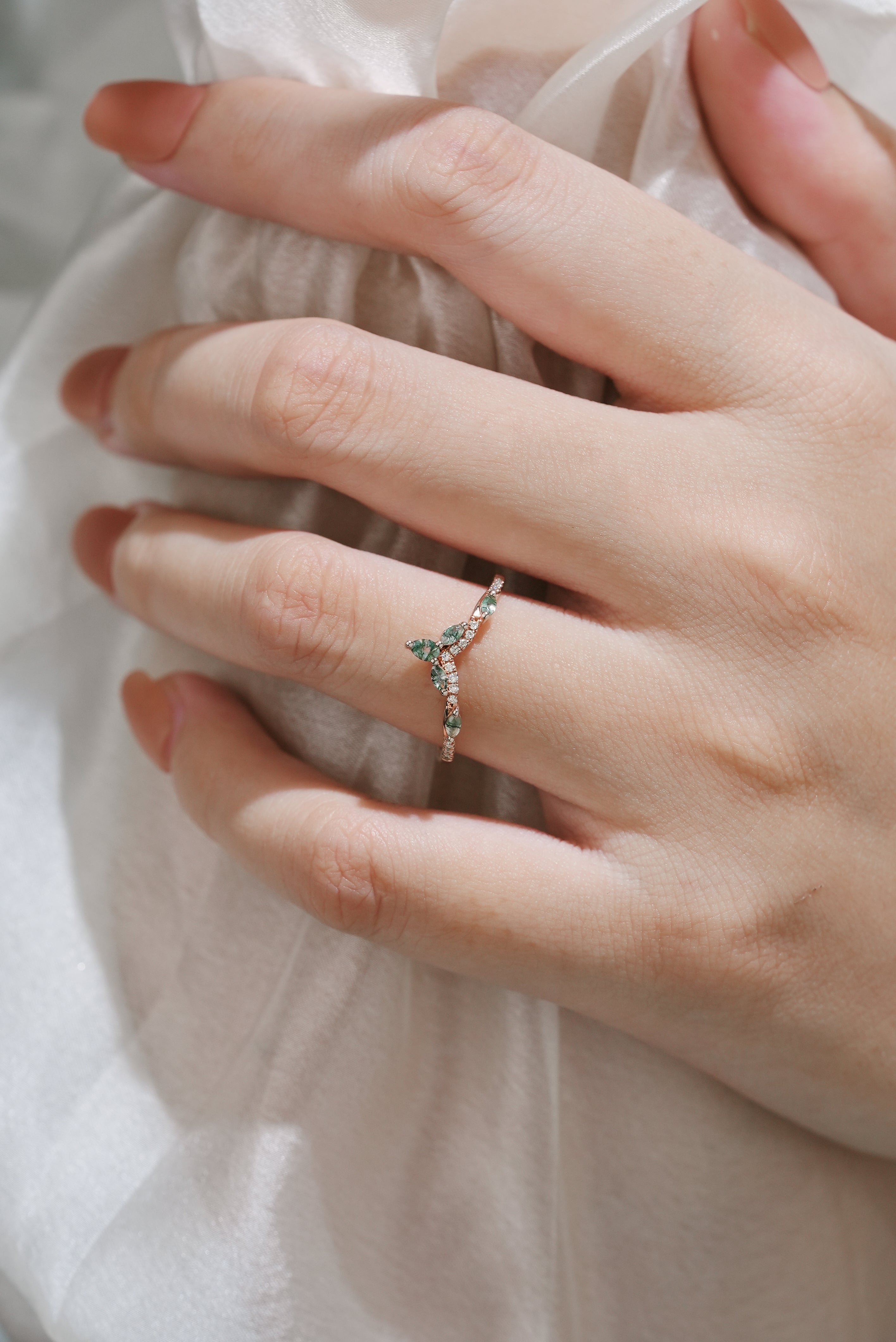 Rose gold moissanite and moss agate wedding band in a leaf design, vintage style.