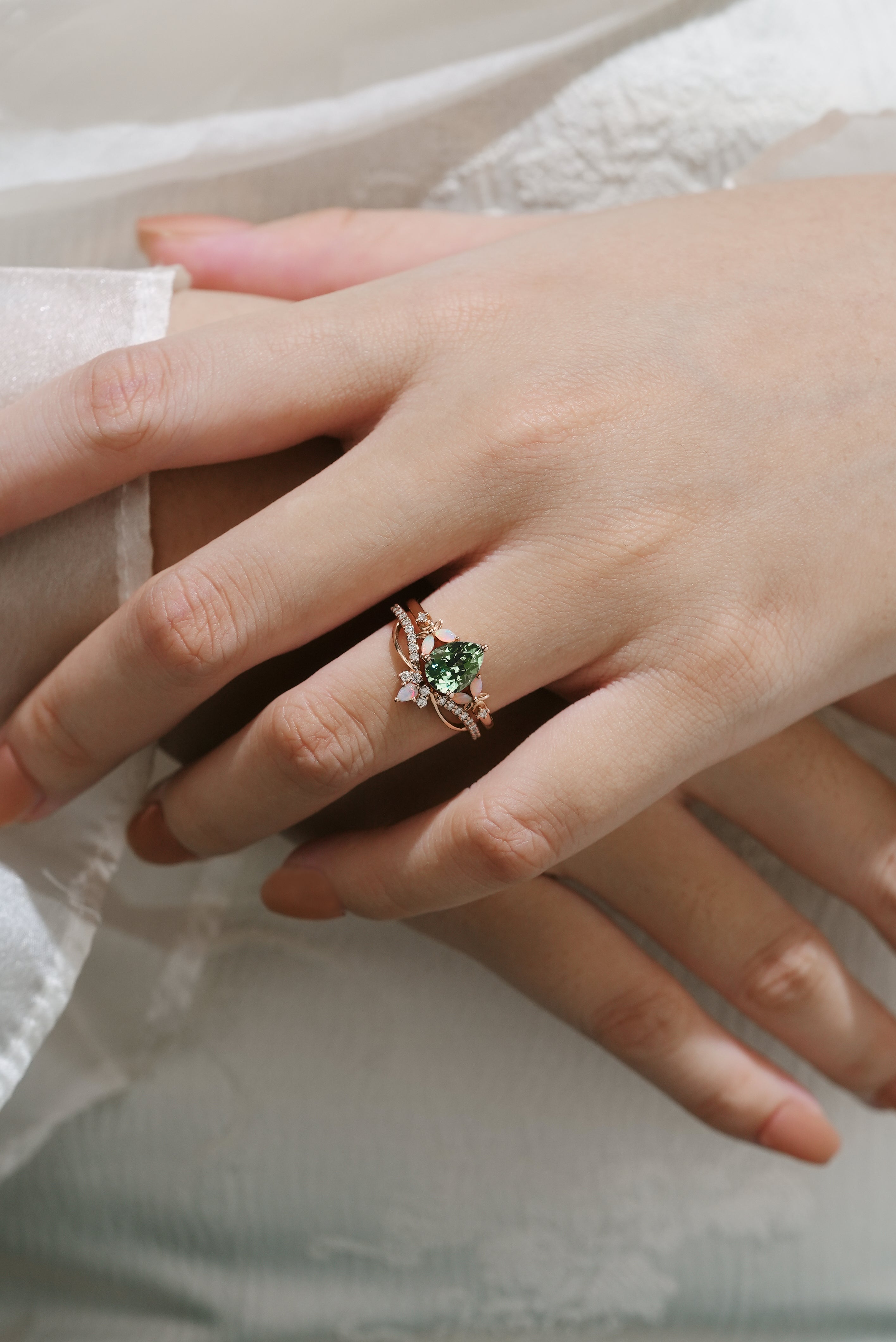 Rose gold floral engagement ring set with green sapphire