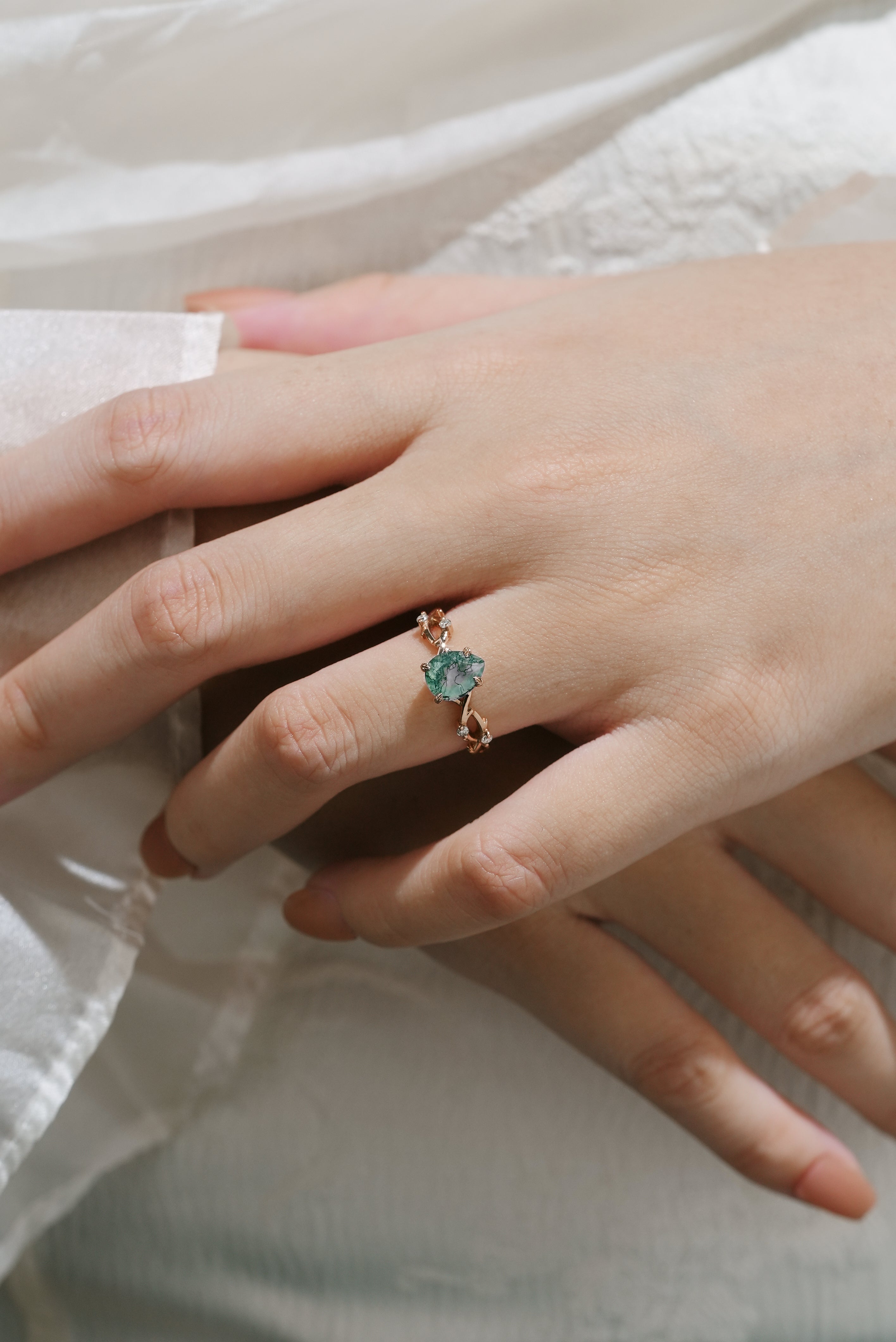 Woman wearing moss agate vine leaf ring, Lahela Jewelry