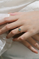 Woman wearing moss agate vine leaf ring, Lahela Jewelry