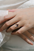 Woman wearing a kite cut alexandrite engagement ring, leaf bridal set, Lahela Jewelry