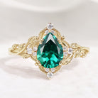 Nature-inspired emerald engagement ring with leaf details
