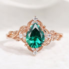 Pear cut lab emerald leaf engagement ring in rose gold