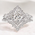 Nature-inspired pear cut diamond engagement ring set