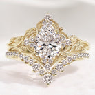 Nature-inspired pear cut diamond engagement ring set with leaf design