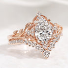 Rose gold pear cut lab diamond leaf engagement ring set with halo