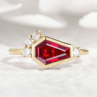 Gold coffin cut ruby engagement ring with diamond accents
