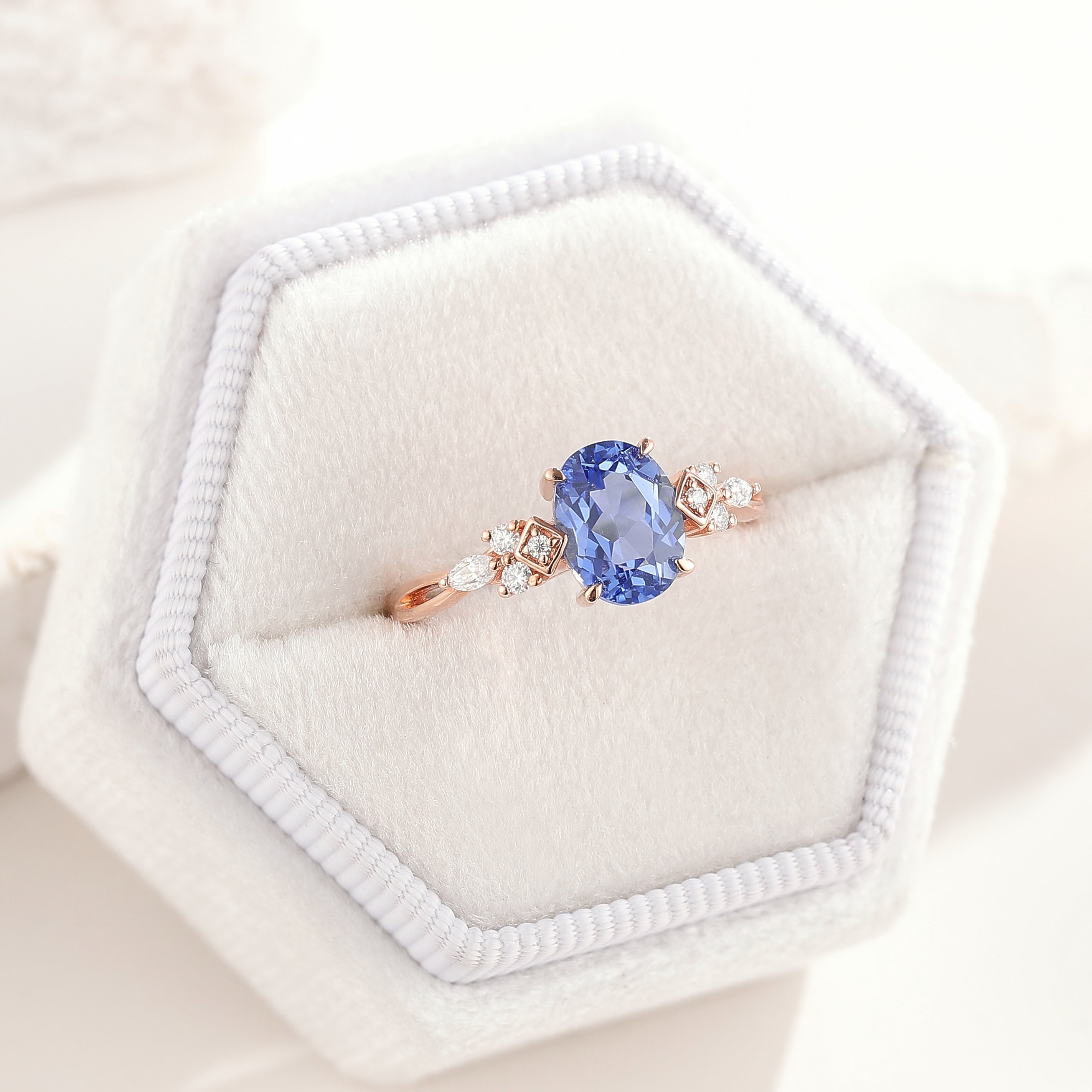 Art Deco Oval Cut Cornflower Sapphire Engagement Ring In A White Ring Box