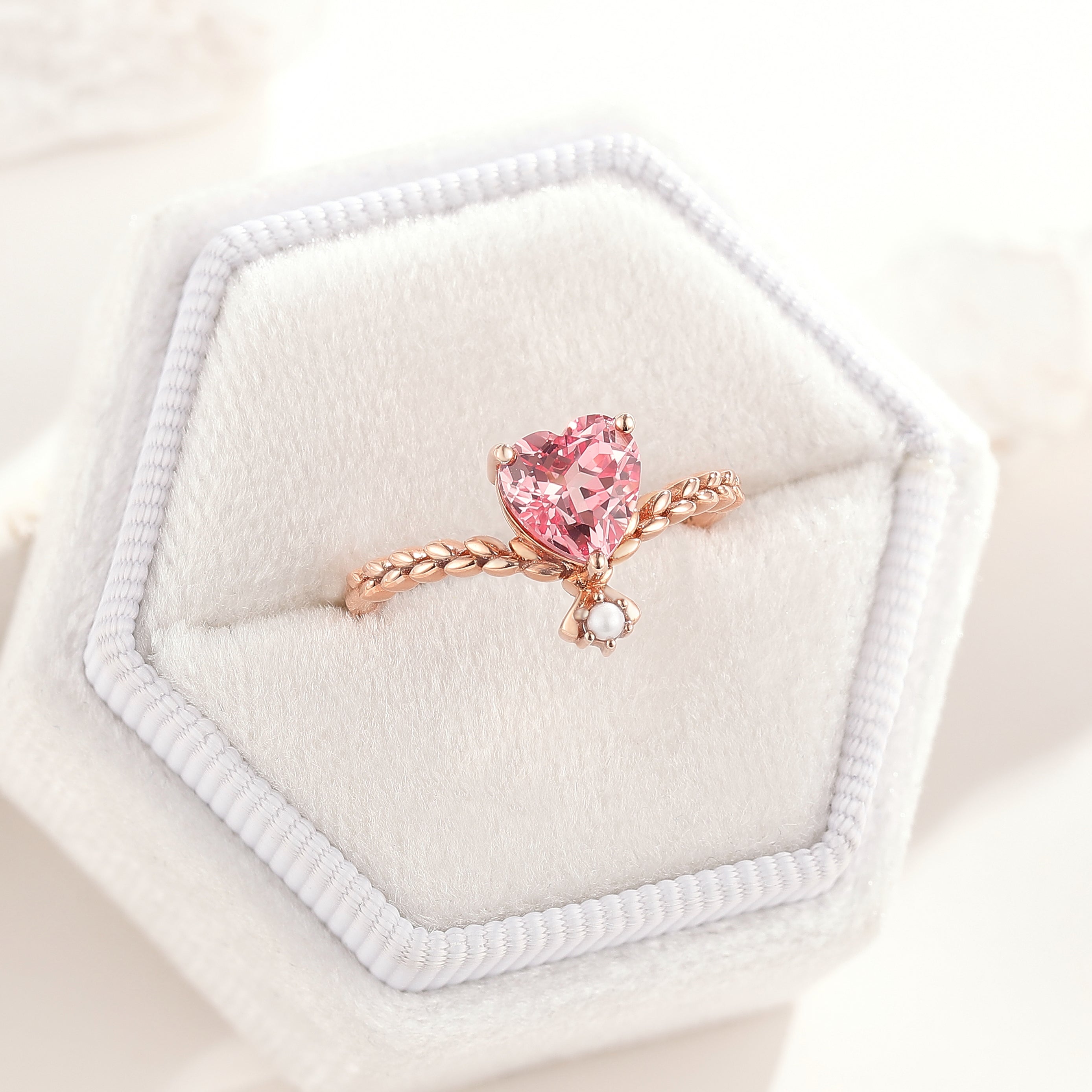 Unique Heart Shaped Pink Sapphire Engagement Ring Pearl Twist Ring In A White Ring Box