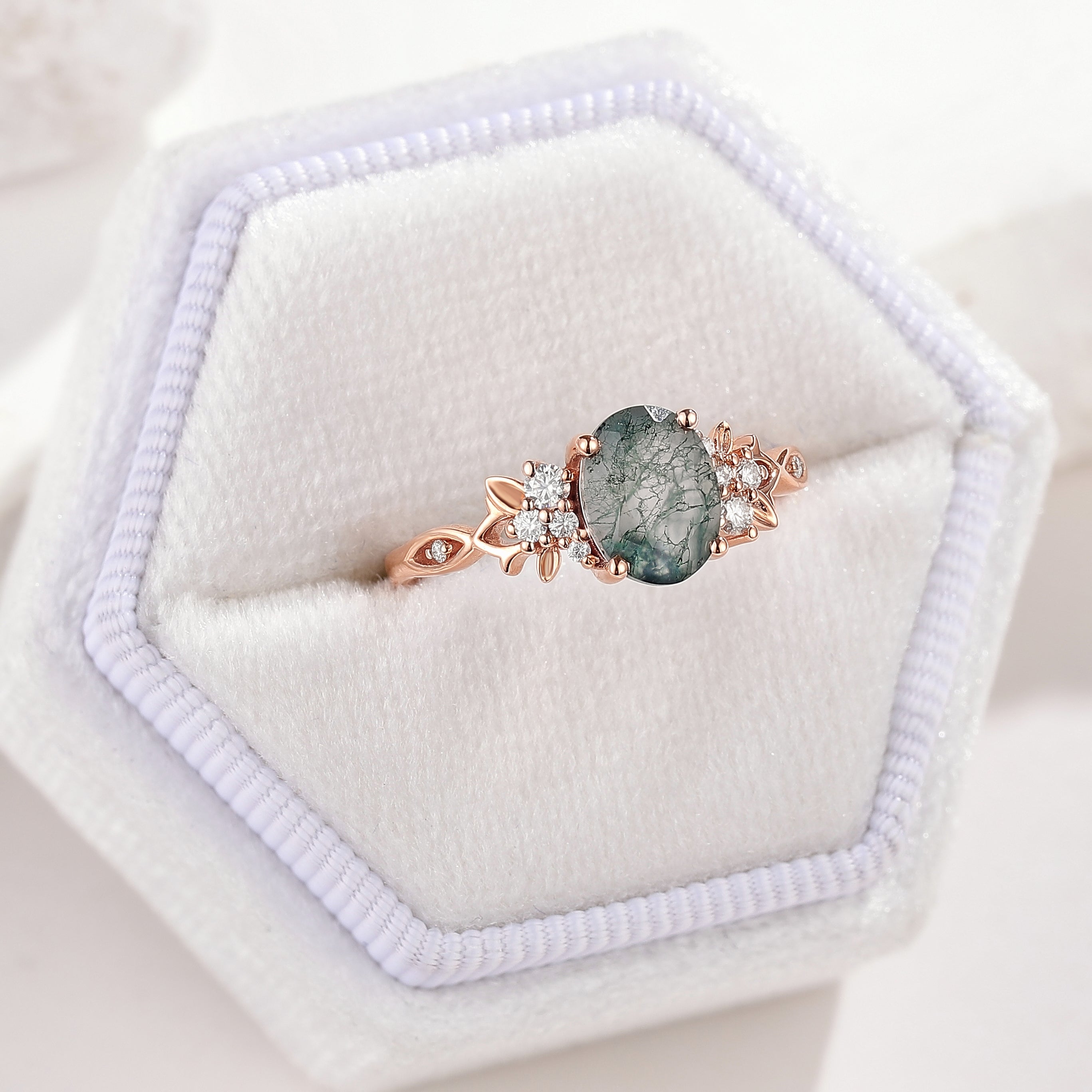 Oval Cut Moss Agate Engagement Ring Nature Inspired Leaf Ring In A White Ring Box