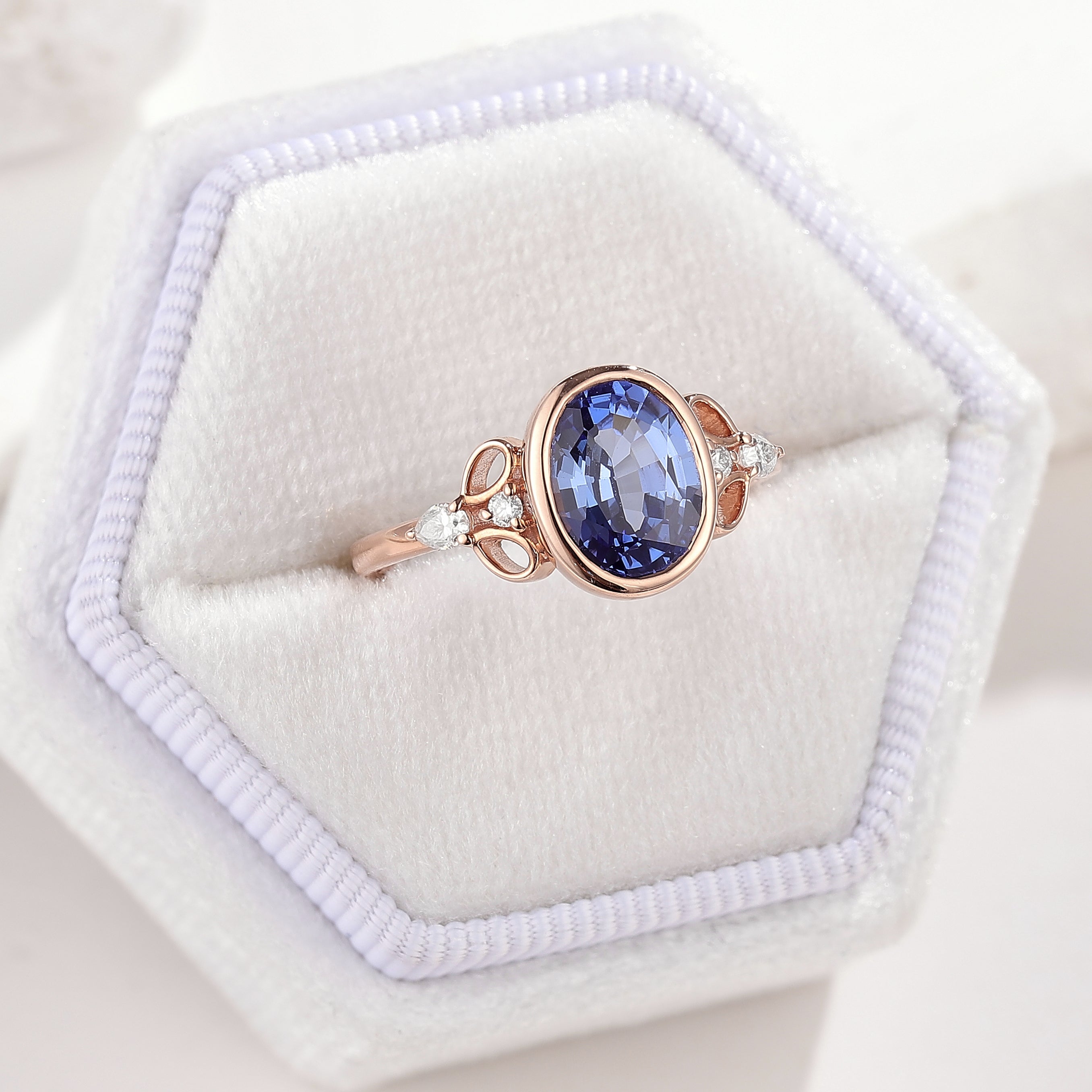 Dainty Oval Cut Blue Sapphire Engagement Ring In White Ring Box