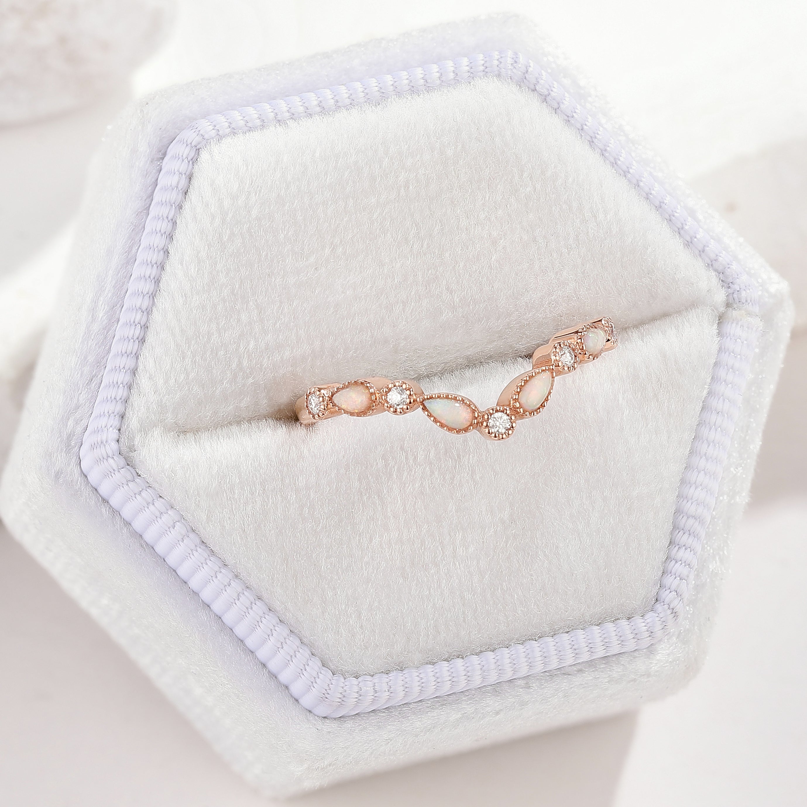 Rose gold chevron wedding band with opal and moissanite stones