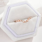 Rose gold chevron wedding band with opal and moissanite stones