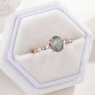 Rose gold oval moss agate engagement ring with moissanite accents