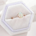 Oval opal engagement ring in rose gold with side stones, Lahela Jewelry