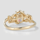 Close-up view of nature-inspired leaf ring with moissanite center