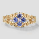 Nature-inspired lab-grown Cornflower sapphire engagement ring with leaf design