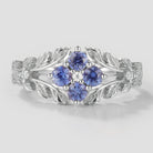 Cornflower sapphire engagement ring with leaf design