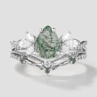 Nature-inspired pear cut moss agate ring set with leaf detailing