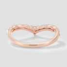 Rose gold V-shaped moissanite wedding band with leaf design