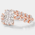 Rose gold emerald cut diamond ring with leaf detail
