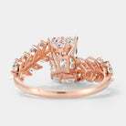 Rose gold engagement ring with leaf detail, emerald cut diamond
