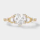 Heart-cut moissanite engagement ring with leaf design