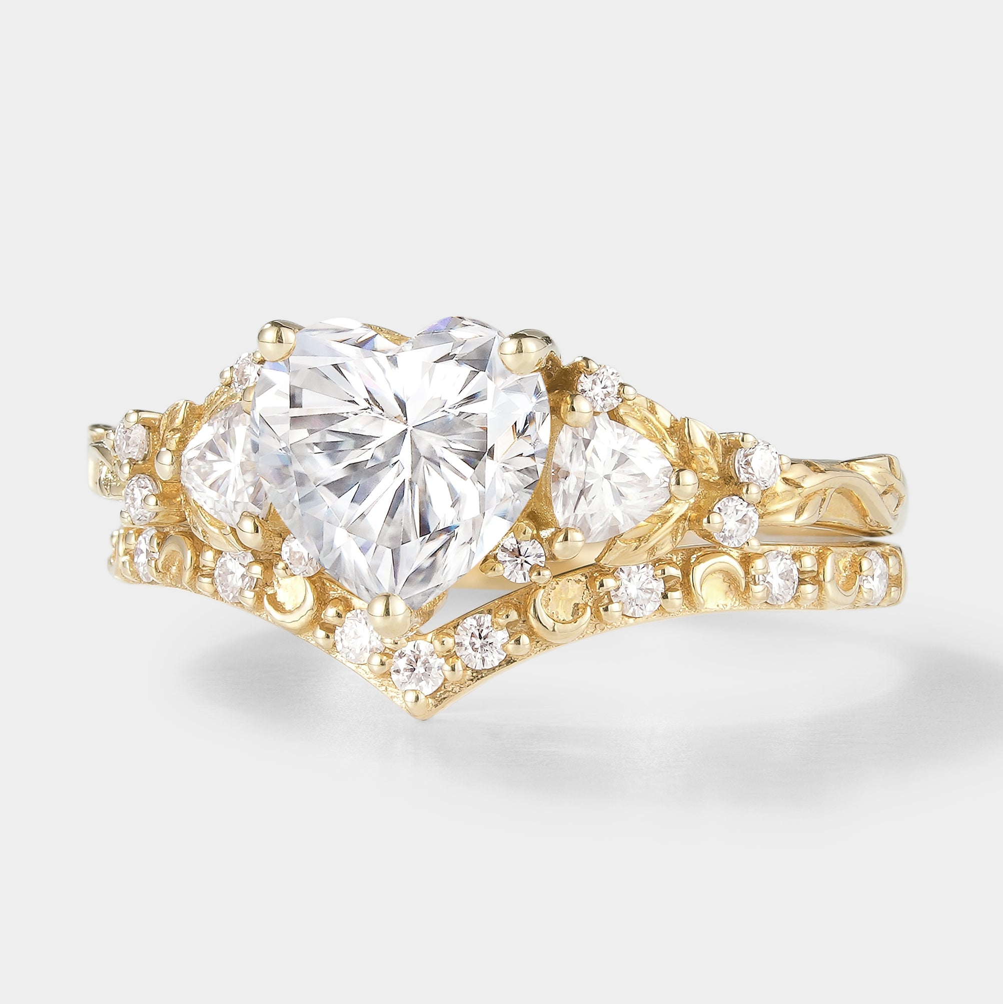 Heart-cut moissanite engagement ring set with leaf and moon design, gold band