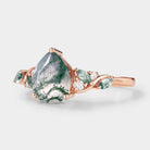 Nature-inspired pear-cut moss agate engagement ring, rose gold setting