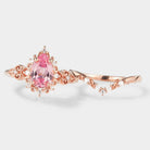 Rose gold Padparadscha sapphire engagement ring set with leaf wedding band
