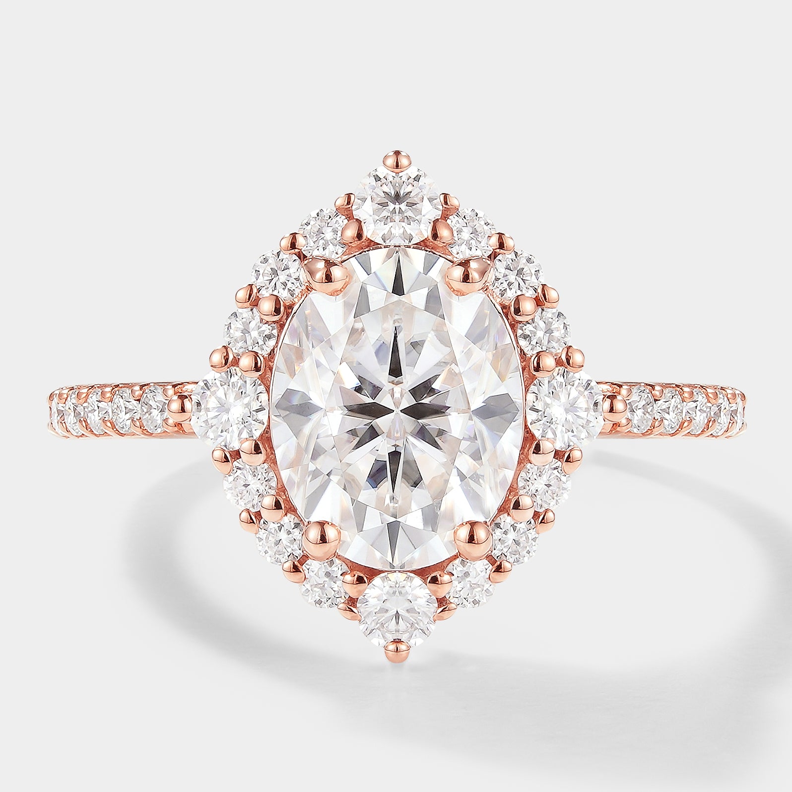 Oval Cut Moissanite Halo Engagement Ring in Rose Gold