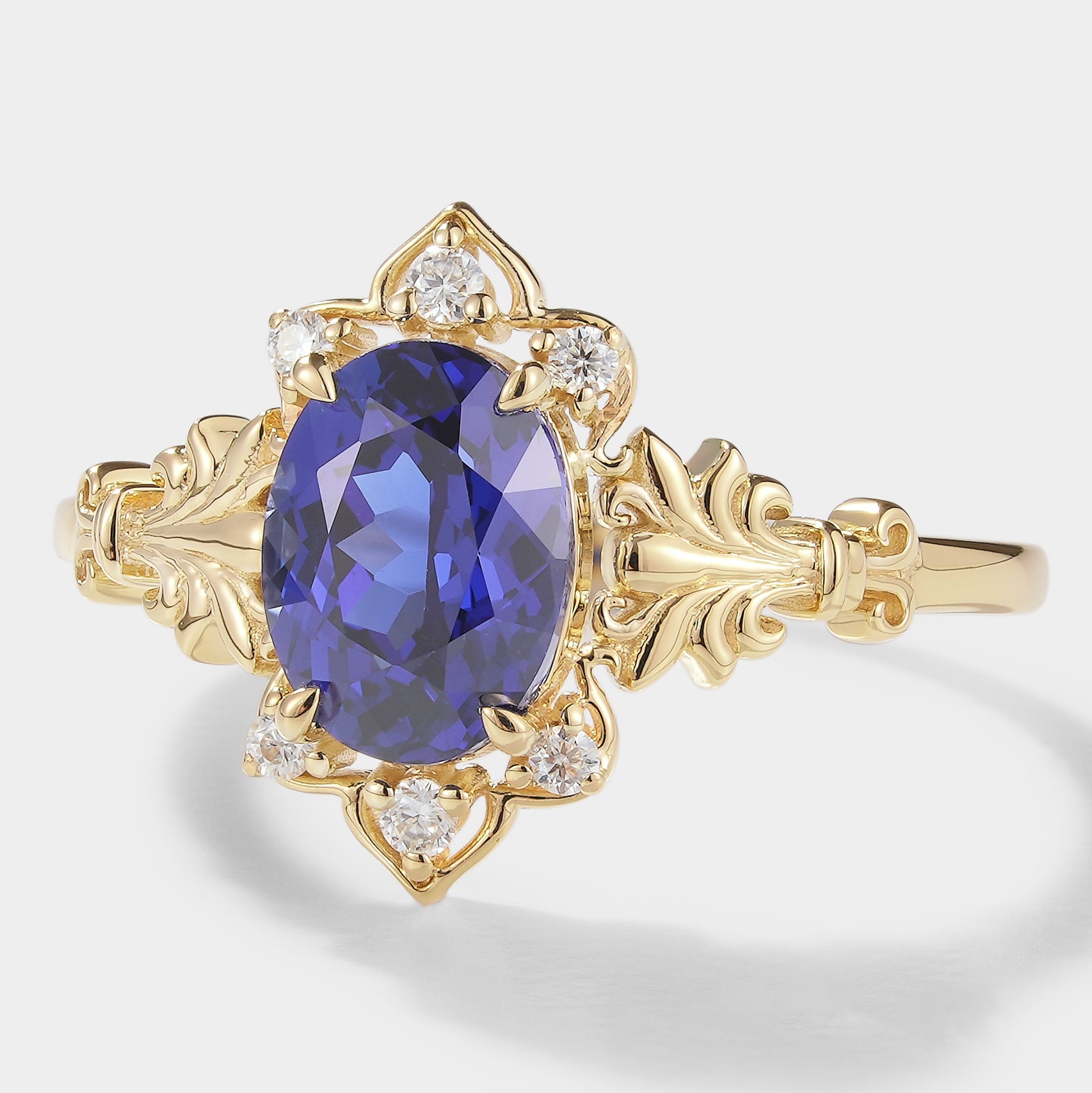 Oval Royal Blue Sapphire Engagement Ring with Floral Design
