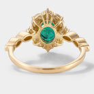 Detailed back view of emerald and moissanite engagement ring